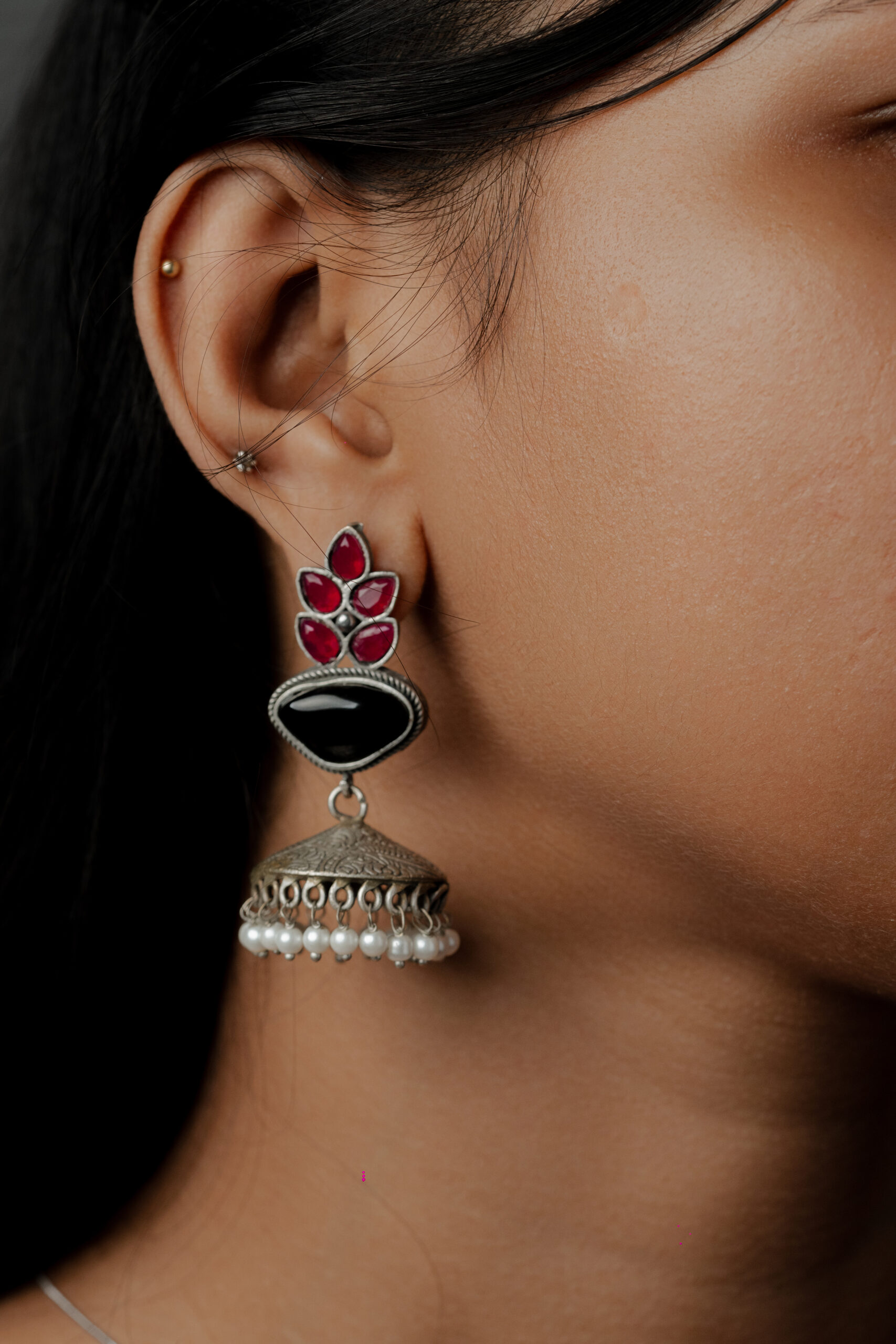 Traditional Jhumka Earrings with Red Stones and Pearl Detailing – Oxidized Silver Finish”