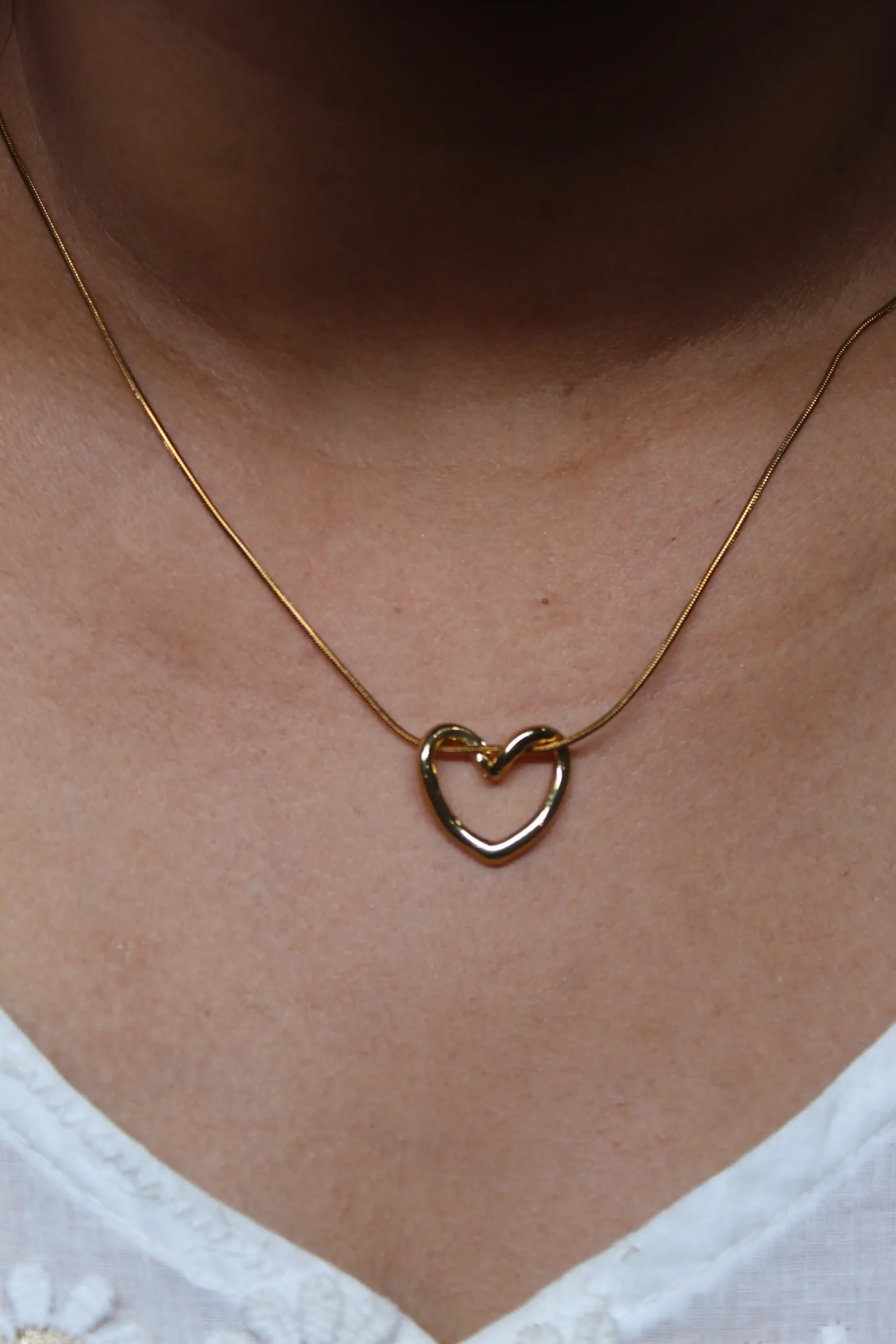 Gold Heart Necklace,” “Intertwined Heart
